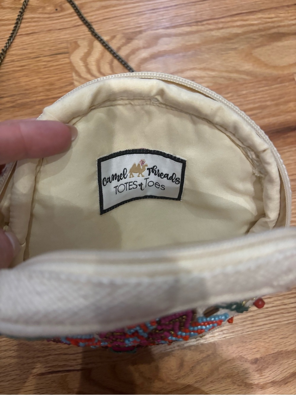 Embroidered Round Crossbody Bag in White with Pink Tassel - Picture 4 of 4